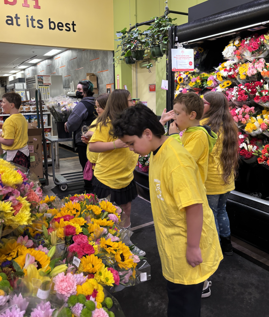 Fun Friday took BRIDGE Program students on a special trip to Hannaford's in Sanford! Students toured the whole store, enjoyed samples of fresh strawberries, watermelon, cheese, mozzarella sticks, and cookies, and even got up close with the live lobsters in the tank. Along the way, they connected with staff and learned how a grocery store runs from the inside out.