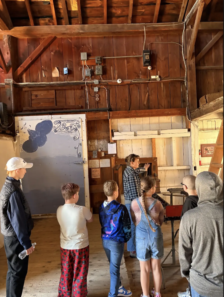 Polly McDougal gives the students a tour.