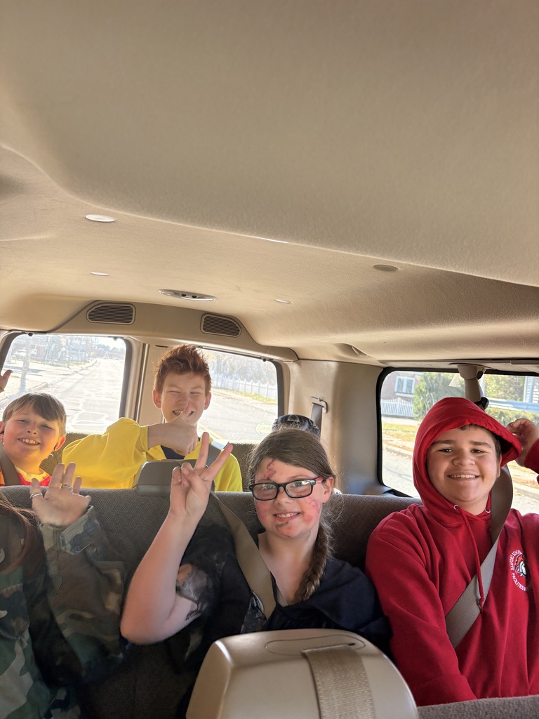 Four students ride in a bus.