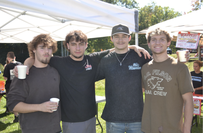 Four boys pose together.