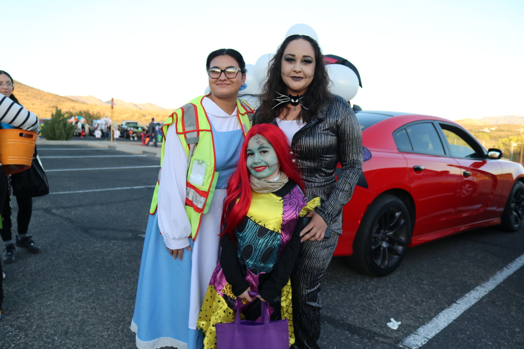 Family posing for photo in costumes