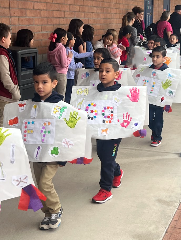 Kinder students walking in ABC parade.