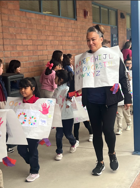 SPED aide walking with students