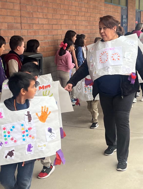 SPED aide walking with students