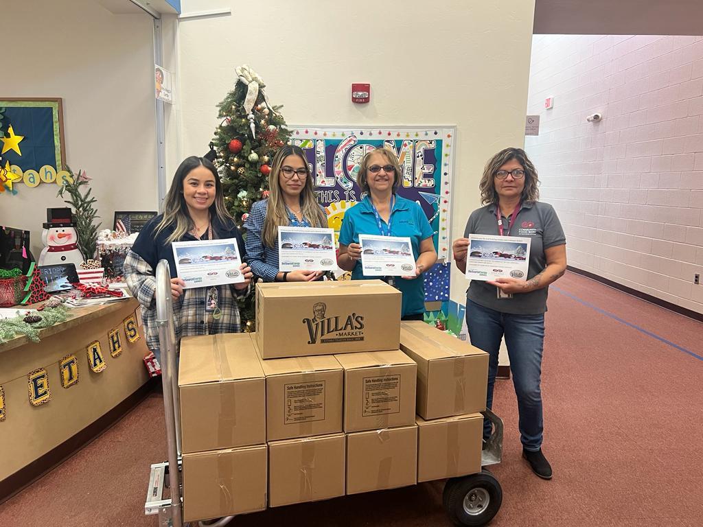 San Cayetano staff accepts food boxes