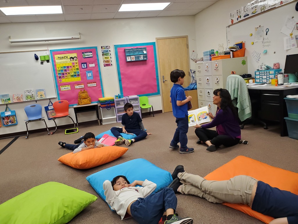 Guest reader reading to a class.