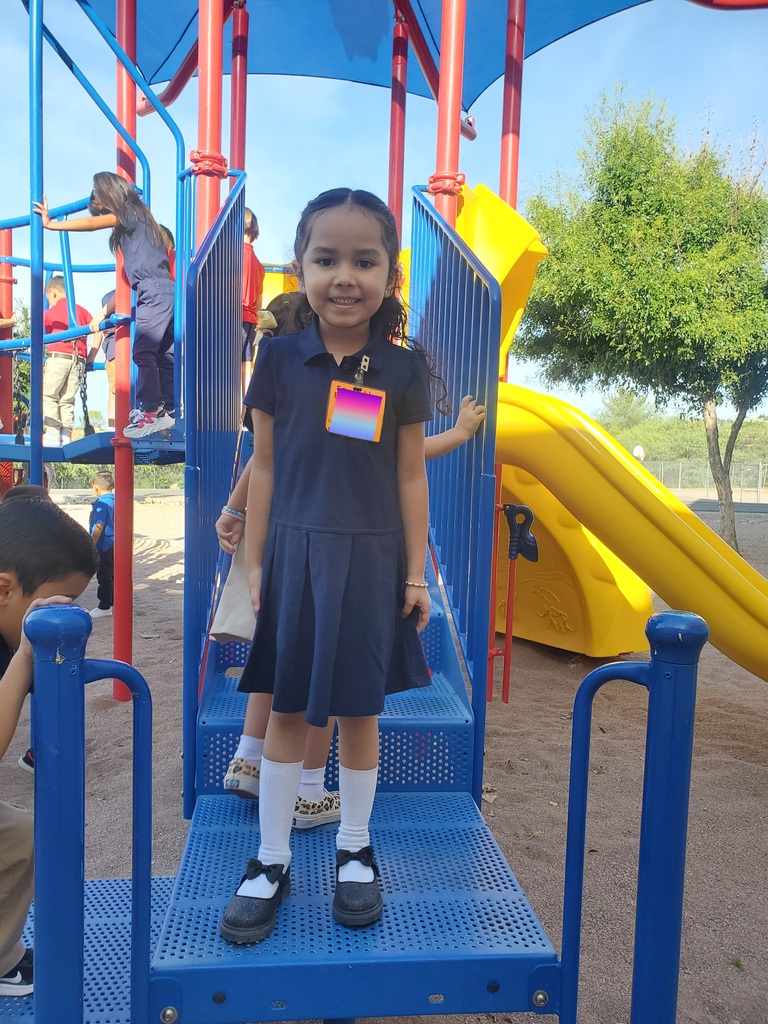 student posing for picture on jungle gym