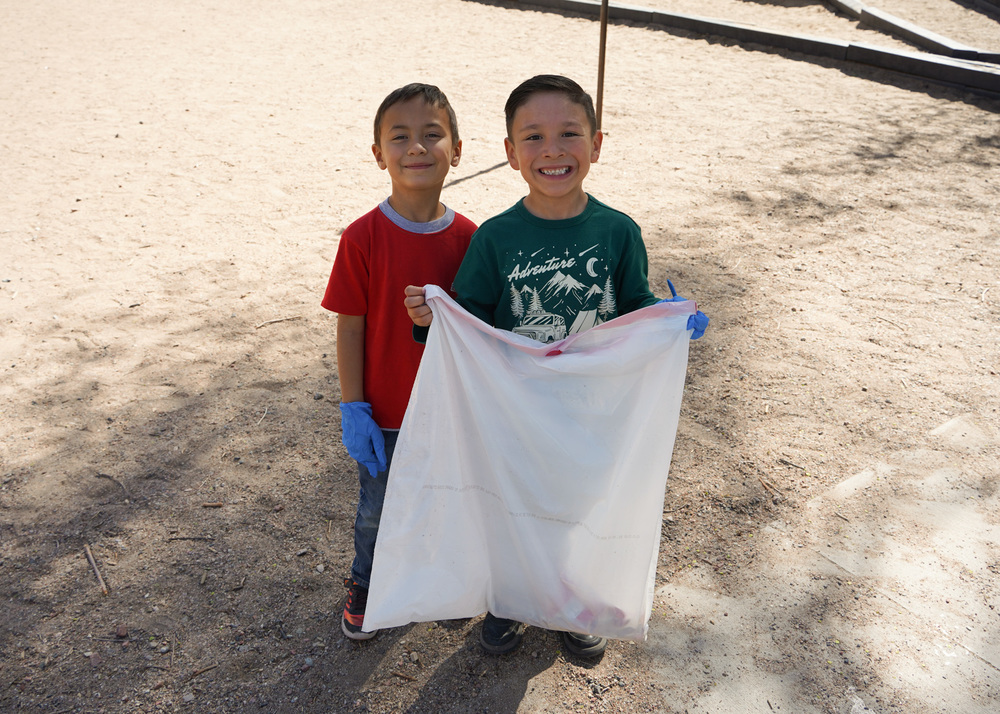 boys with trash bag