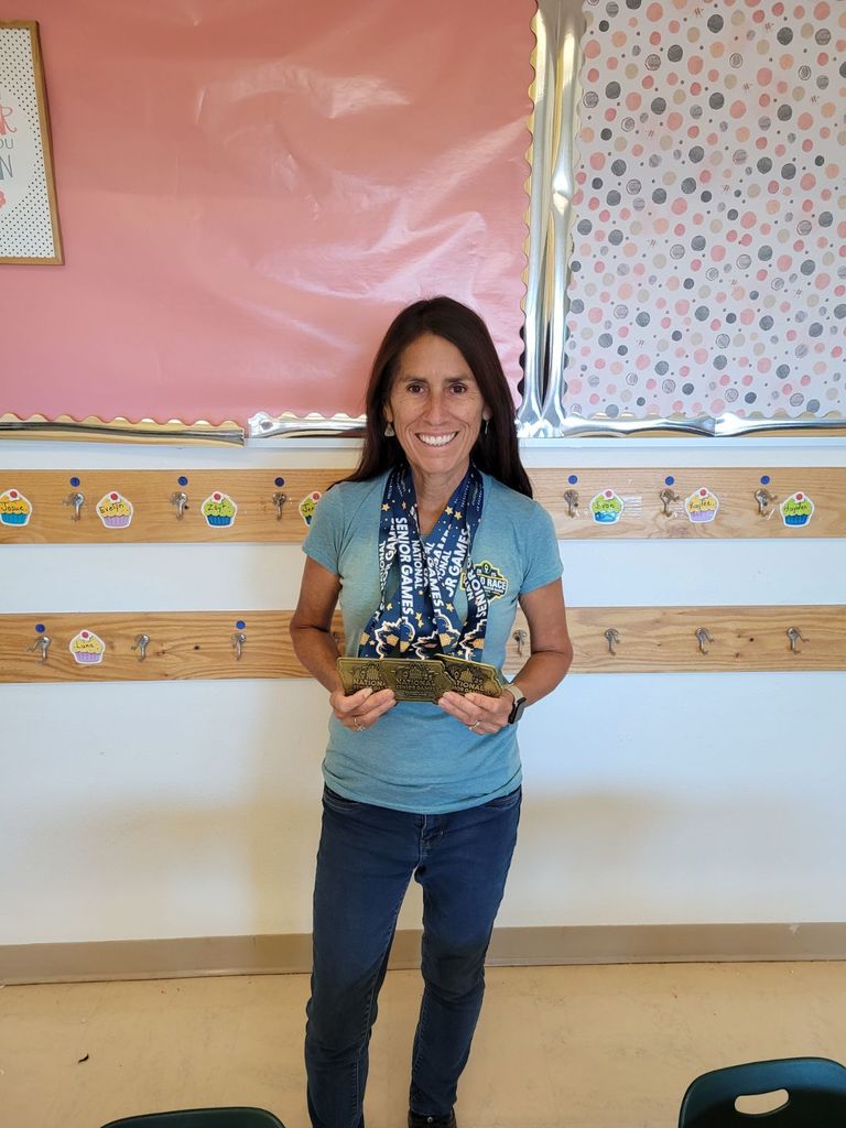 Mrs. Vigil with her gold medals