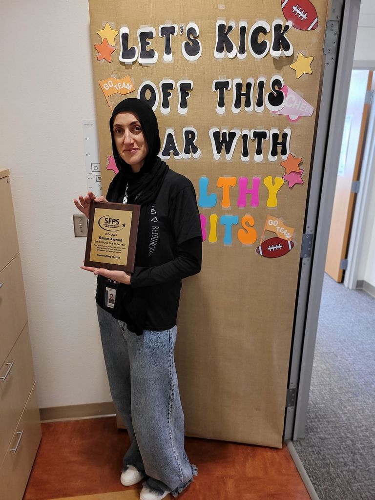 Nurse Summer with her award