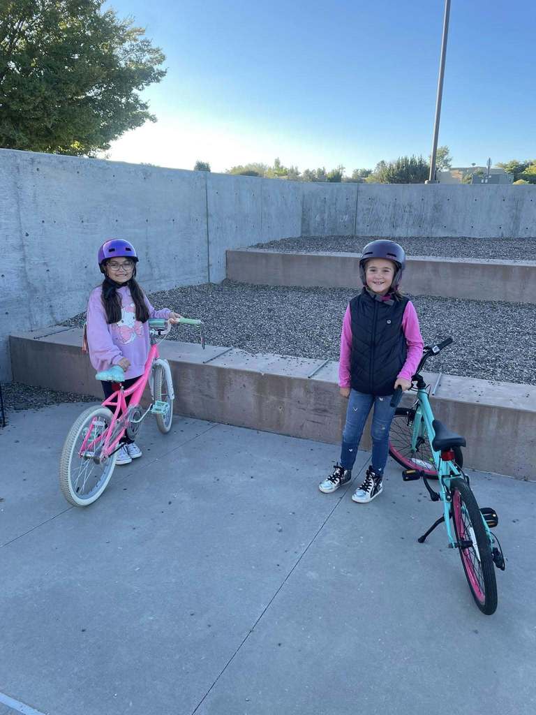 2 girls with their bikes