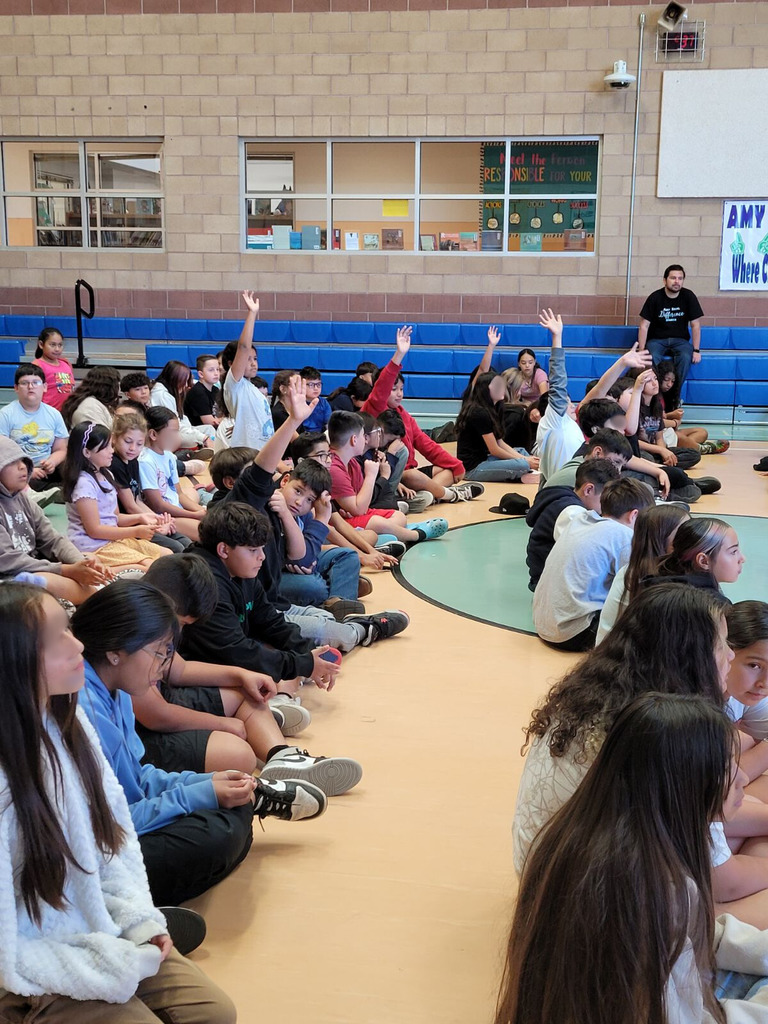 students raising their hands