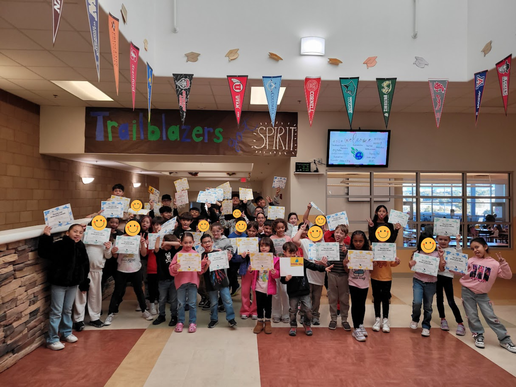 students with awards making silly faces
