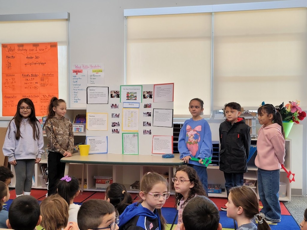 kids with their science fair projects