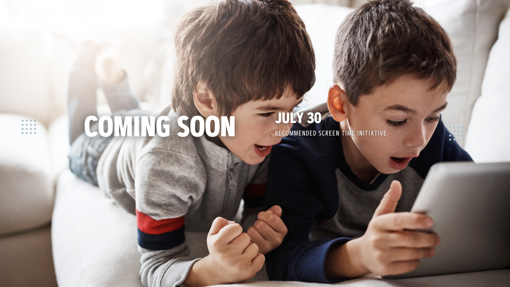 Two young boys lie on a couch, one pointing at a tablet screen, the other watching, with text "COMING SOON JULY 30" and a gray background.