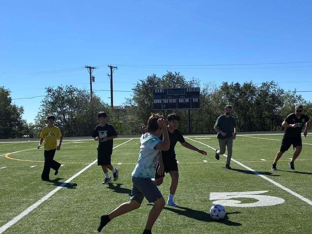Milagro's Staff VS Students soccer game.