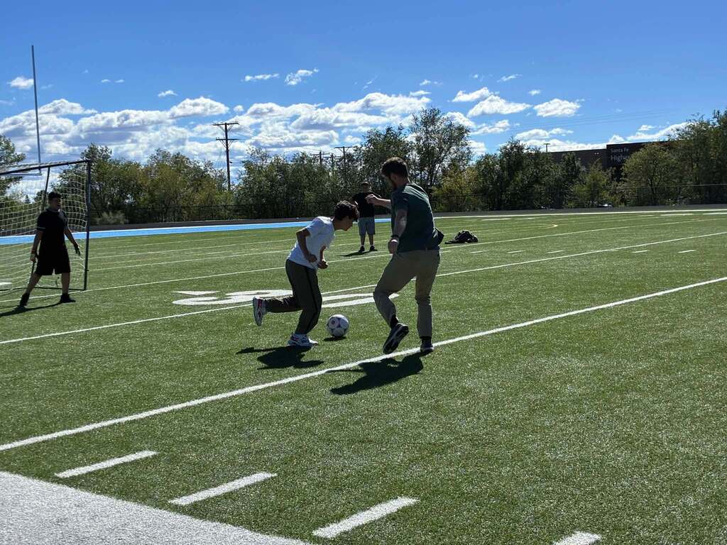 Milagro's Staff VS Students soccer game.