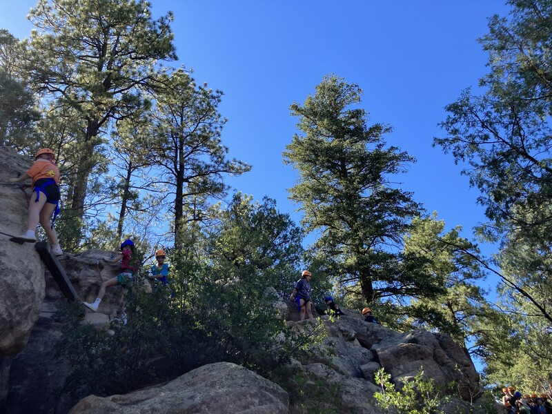 7th graders climb rocks for via ferrata activitiy