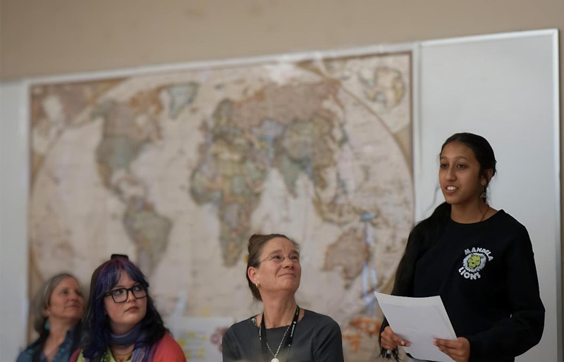 Neytra Gnanakaran, a 10th grader at Mandela, states her view on the New Mexico case against META and social media during Thomson's visit. 