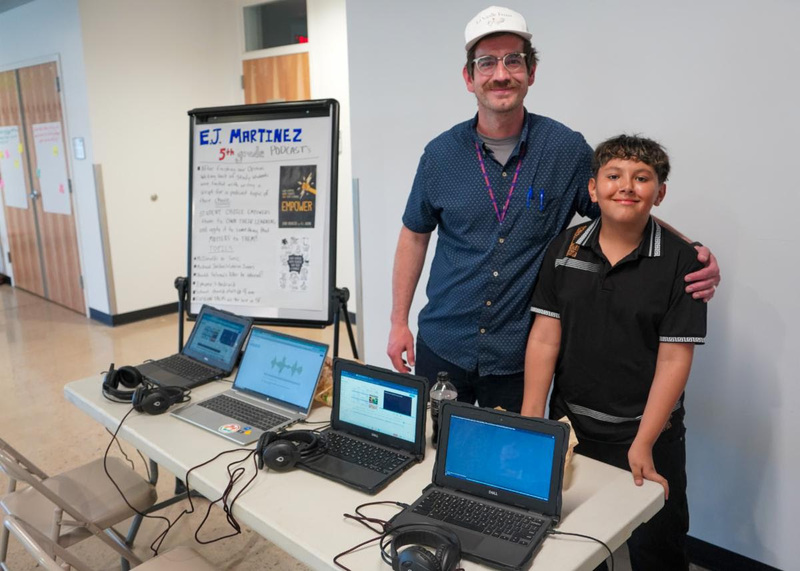 teacher and student show off podcasting equiptment