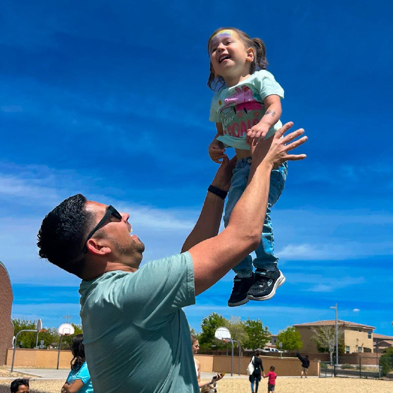 dad plays with his pre-k age daughter