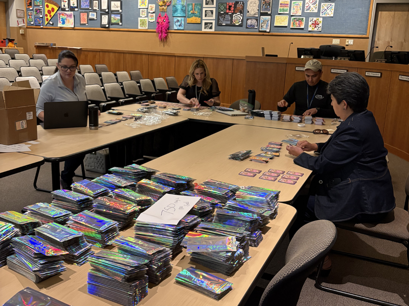  District staff packed and sealed over 7,000 card packs by hand as part of the SFPS Digital Wellness Trading Card campaign.