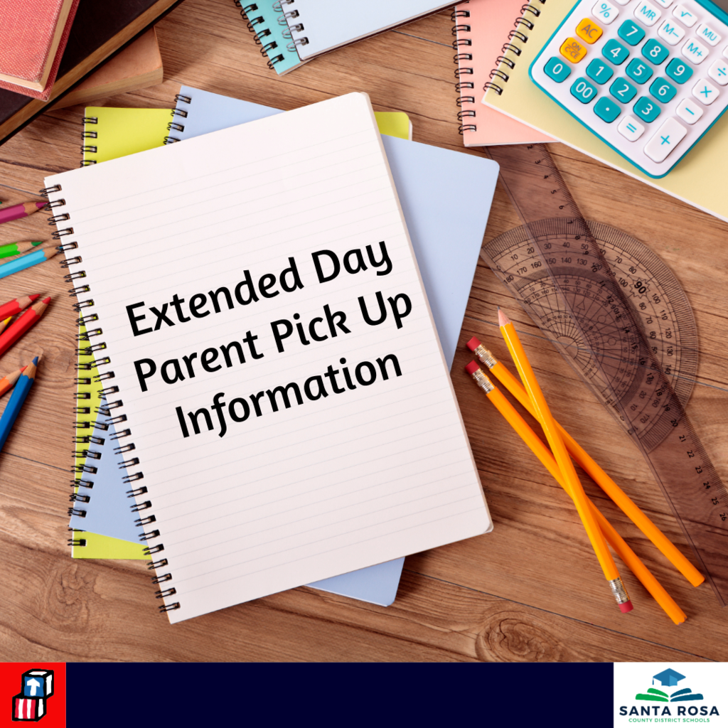 Desk with school supplies including a notebook with Extended Day Parent Pick Up Information printed on it.