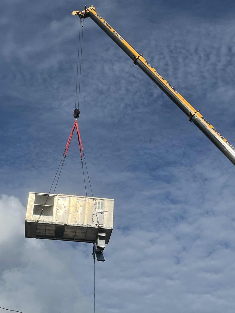 Crane Removing HVAC System in process