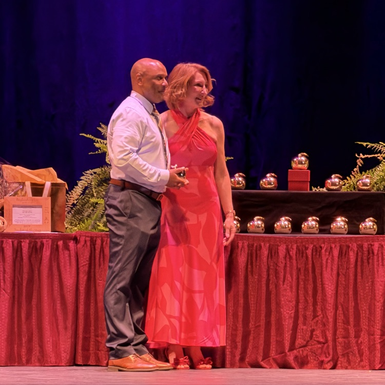 Stallworth on stage with Superintendent 