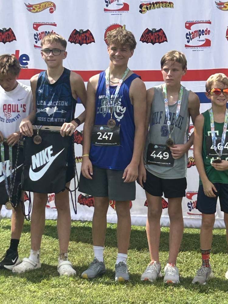 picture of runners with medals