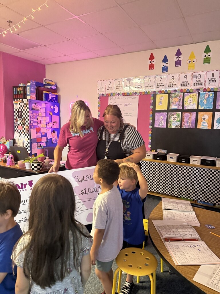Courtney Helms, Kindergarten classroom, receiving Pen Air Credit Union Award