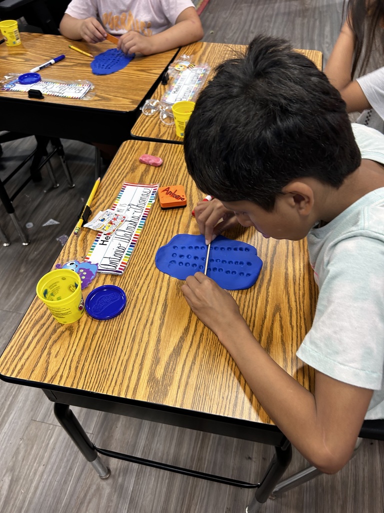 3rd Grade students participating in a hands on math activity