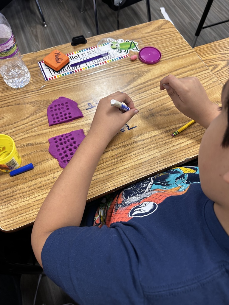 3rd Grade students participating in a hands on math activity
