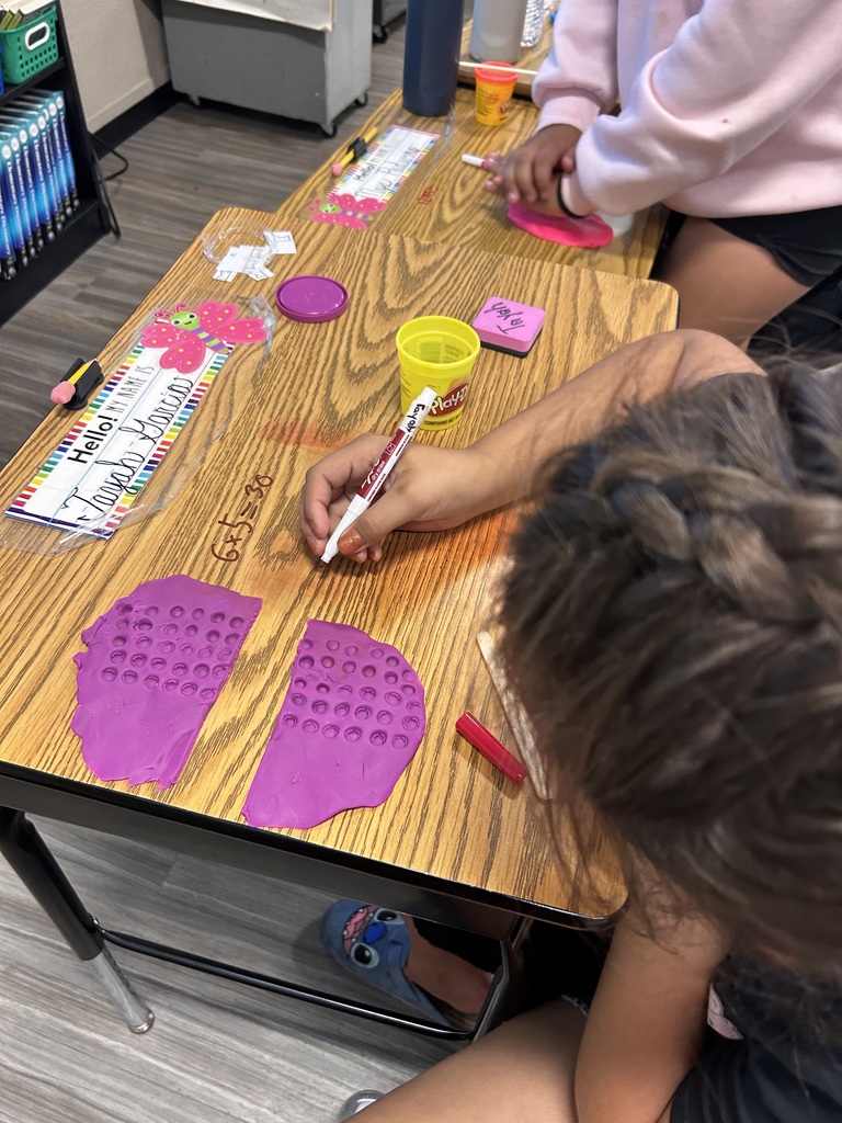 3rd Grade students participating in a hands on math activity