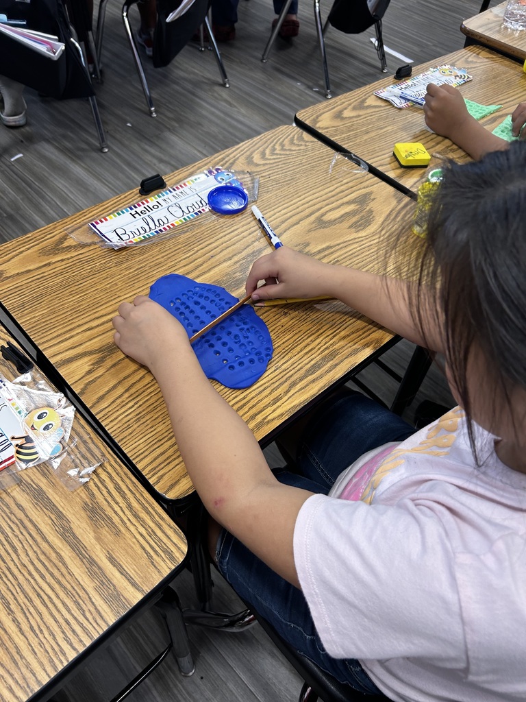 3rd Grade students participating in a hands on math activity
