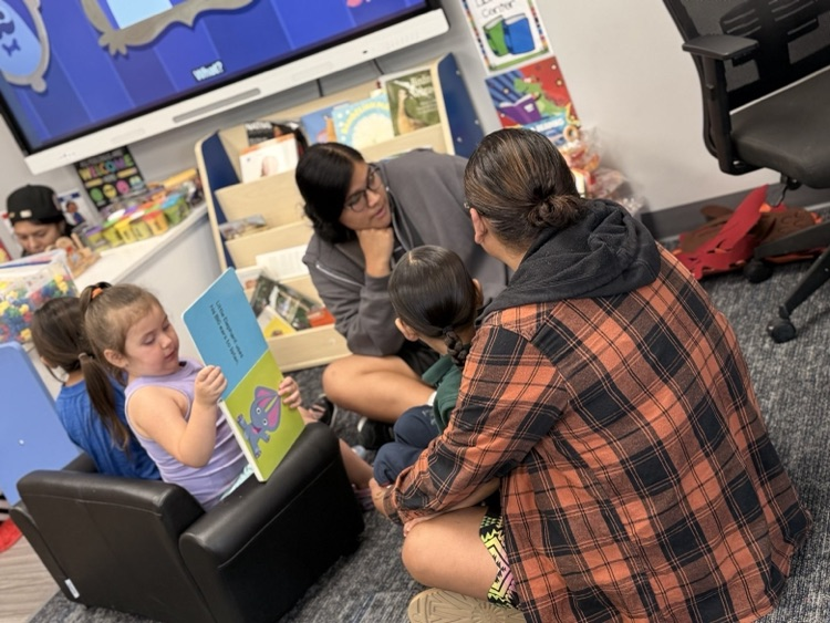 pictures of our volleyball students reading to our headstart students. 