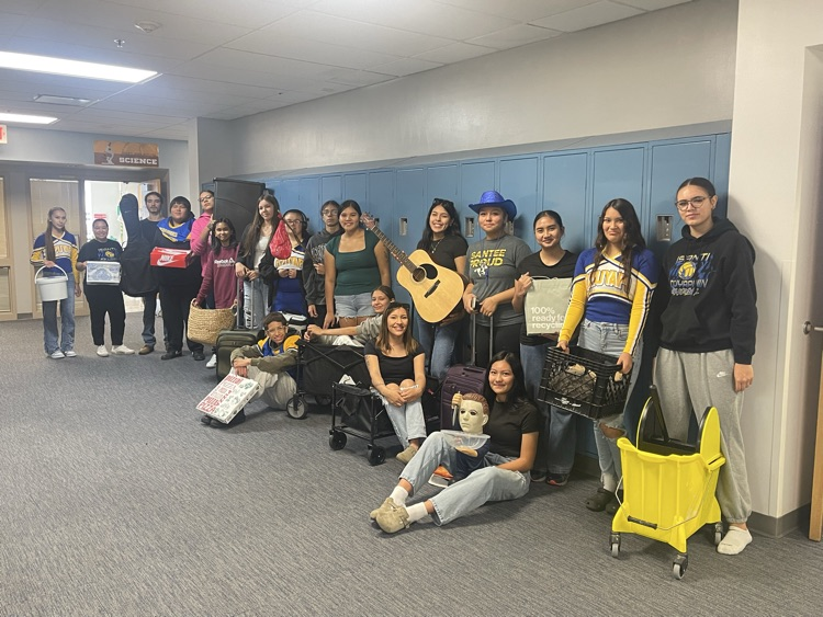 picture of students with items for anything but a backpack day at school