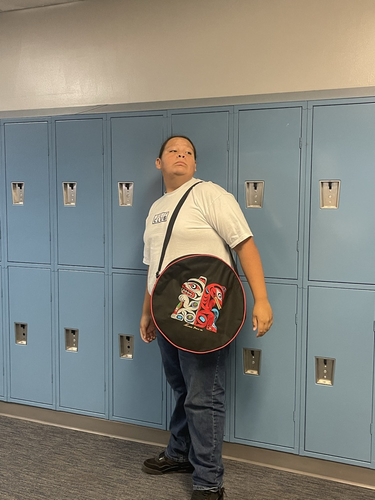 student with his drum bag 