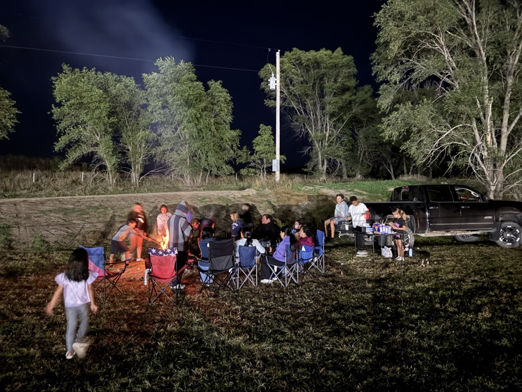 picture of students around the bonfire 