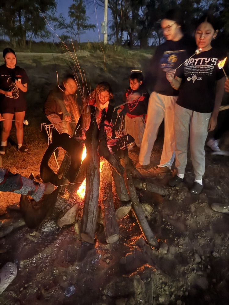 picture of students around the bonfire