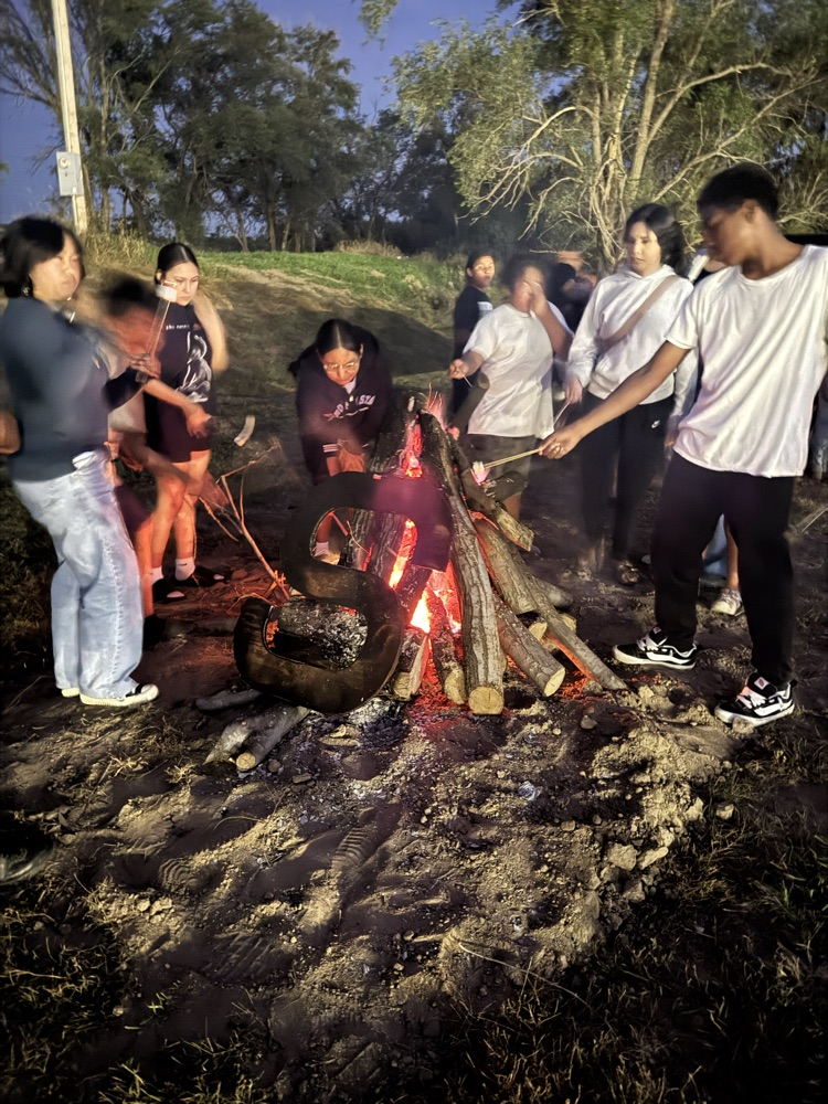 picture of students around the bonfire