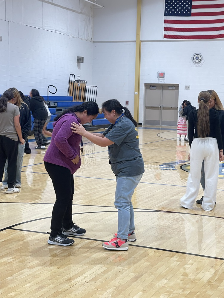 picture of staff and students doing the potato dance.