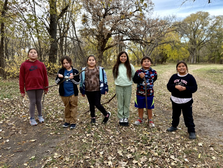 group of 6 students on trail