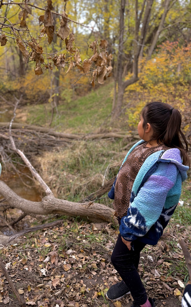 student admiring creek