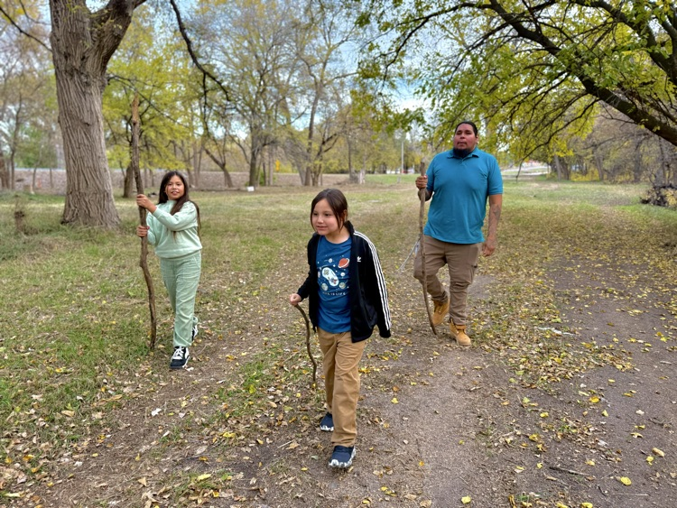 students with walking sticks