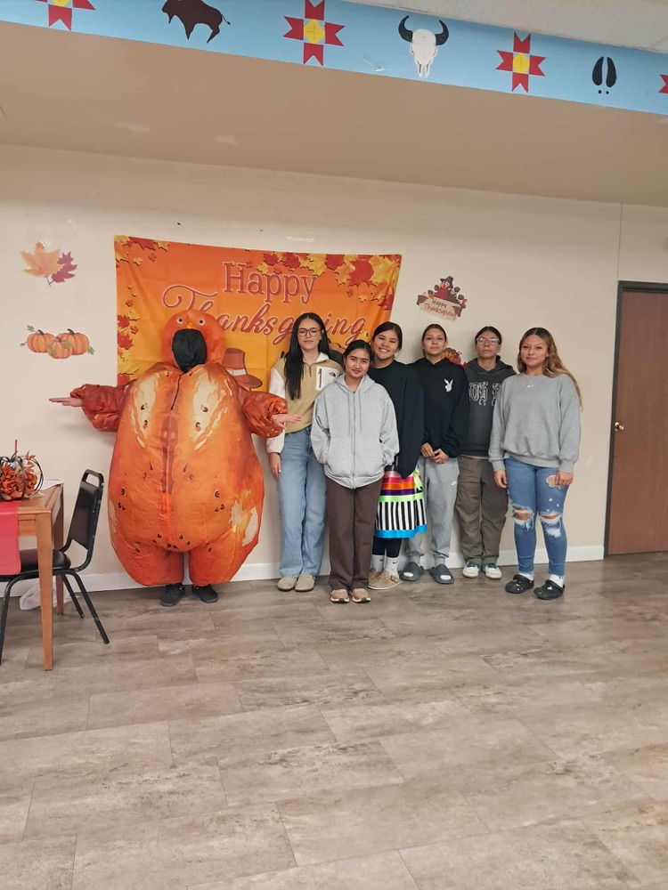 picture of students standing with an inflatable turkey