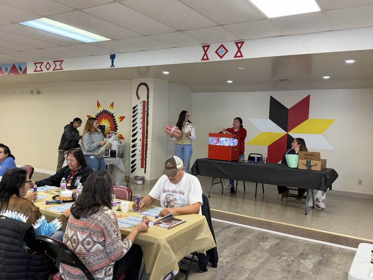 picture of students serving lunch to the elders
