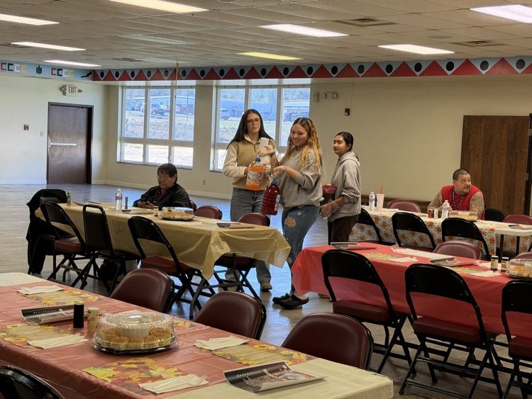 picture of students serving lunch to the elders