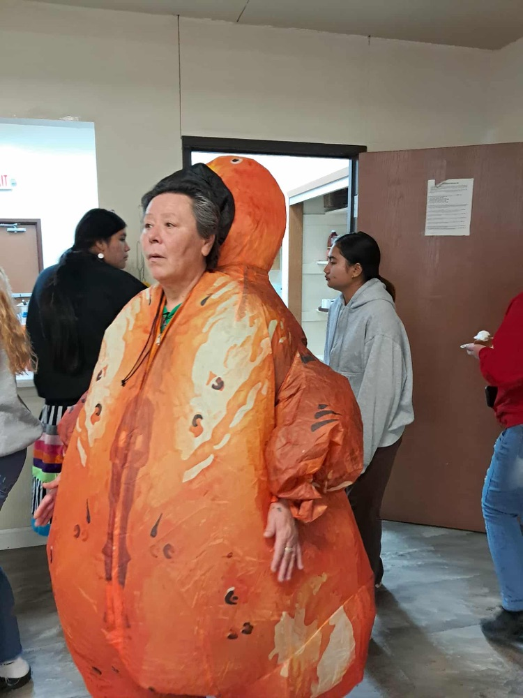 person in an inflatable turkey suit