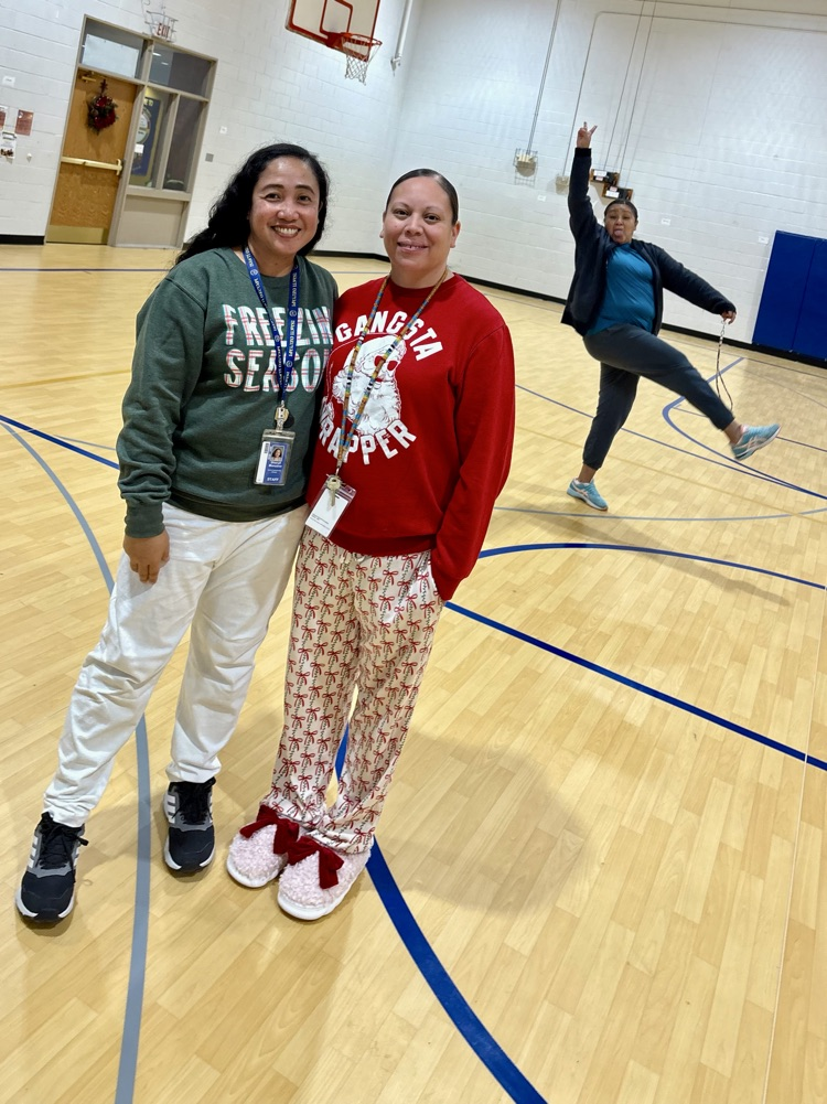 picture of staff in their holiday pajamas for the party 